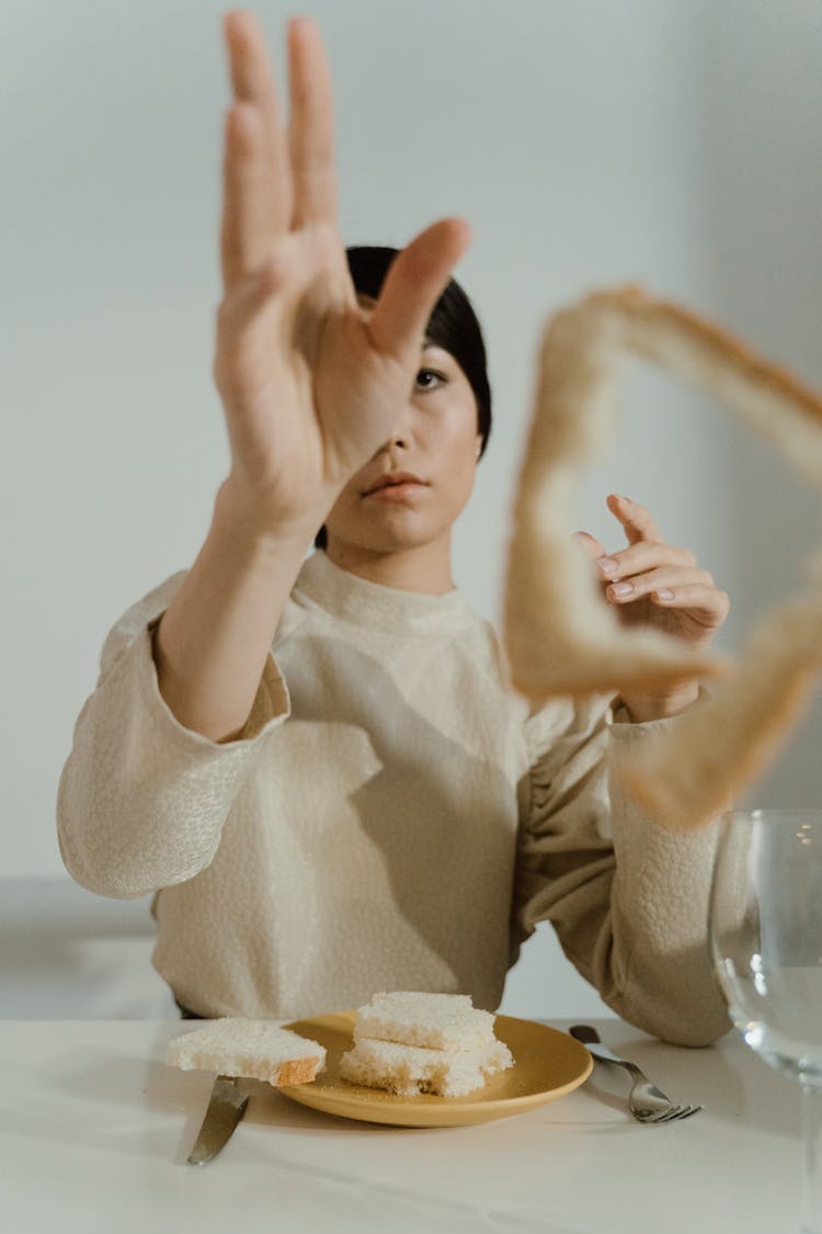 A Woman Holding A Bread