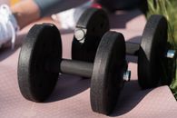 Black and Gray Dumbbells on Brown Carpet