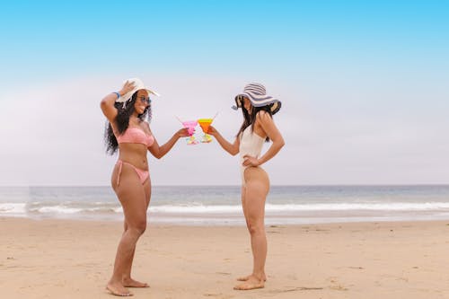 Women in Bikinis Having Fun at the Beach