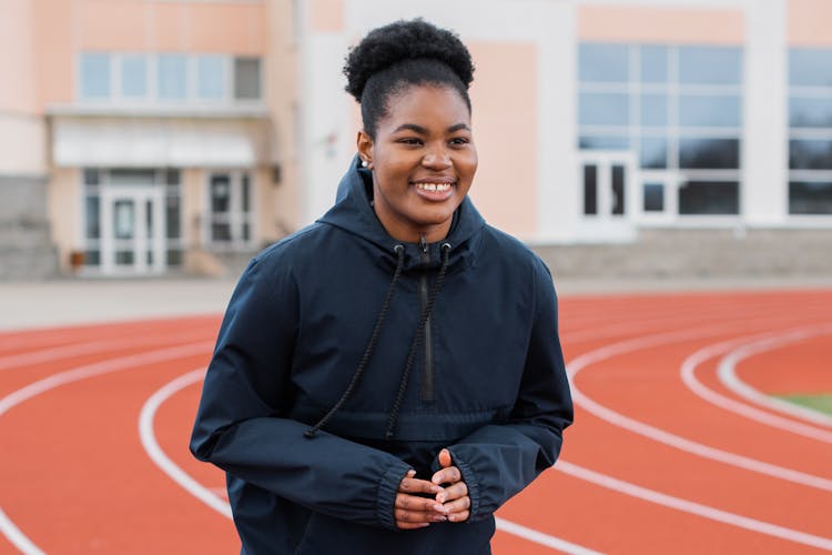 Woman Warming Up At The Track And Field