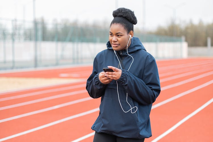 Lady Runner Listening To Music