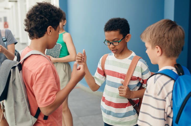 Children Playing Rock Paper Scissors Game