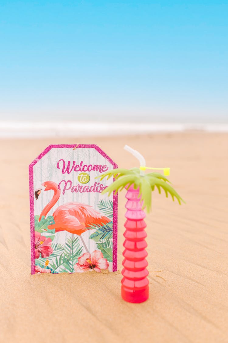 A Welcome Sign On The Beach Sand