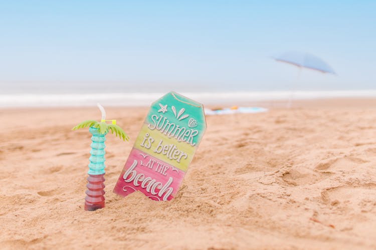 Cocktail And Sign On Sand