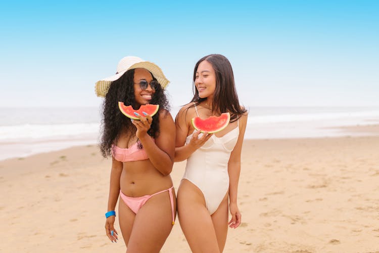 Women Eating Watermelon In The Beach