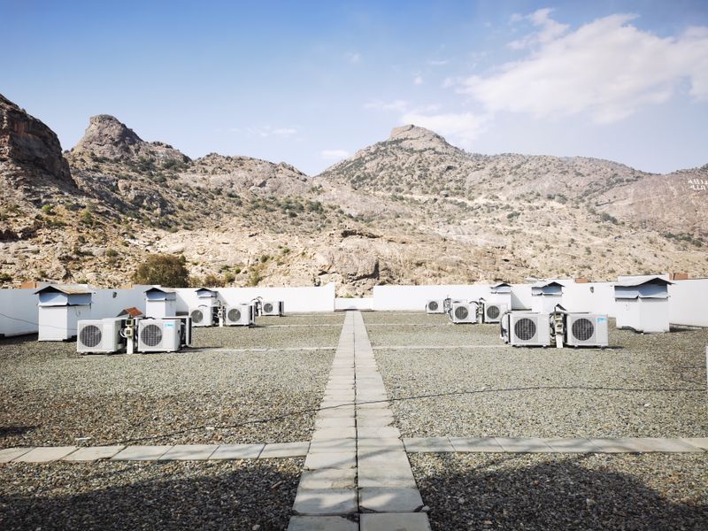 Commercial rooftop packaged HVAC units on flat building roof