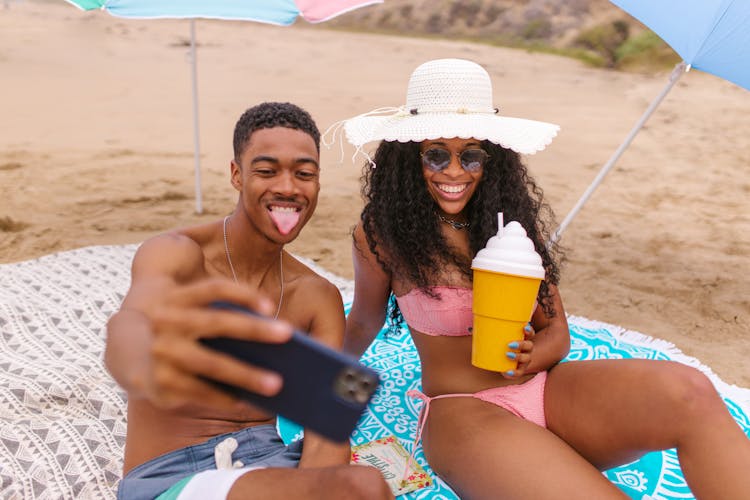 Man Taking Selfie With A  Woman At The Beach