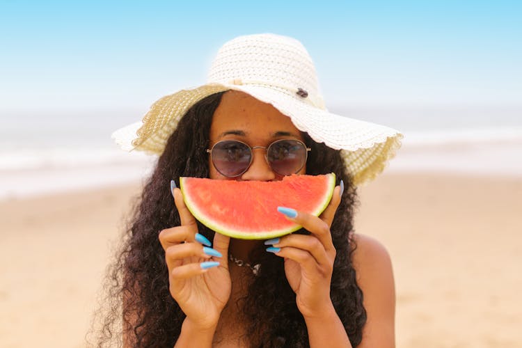 Woman Holding A Slice Of Watermelon