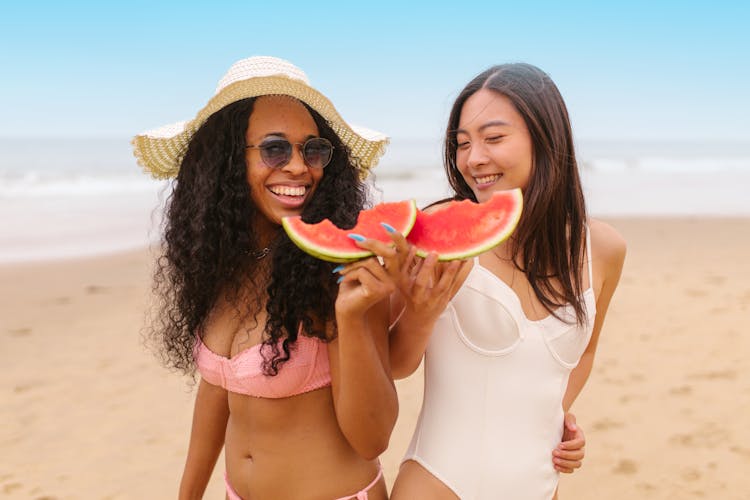 Happy Women Holding Slices Of Watermelon