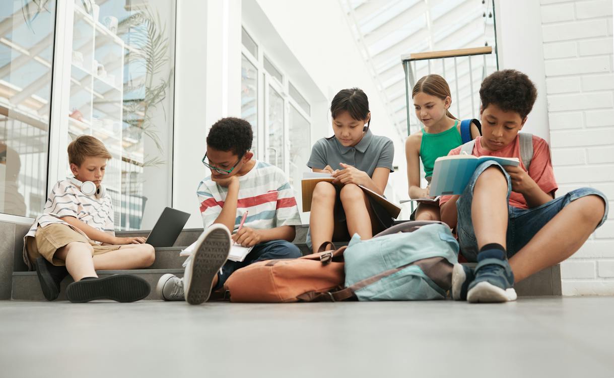 Free 3 Boys and 2 Girls Sitting on Floor Stock Photo