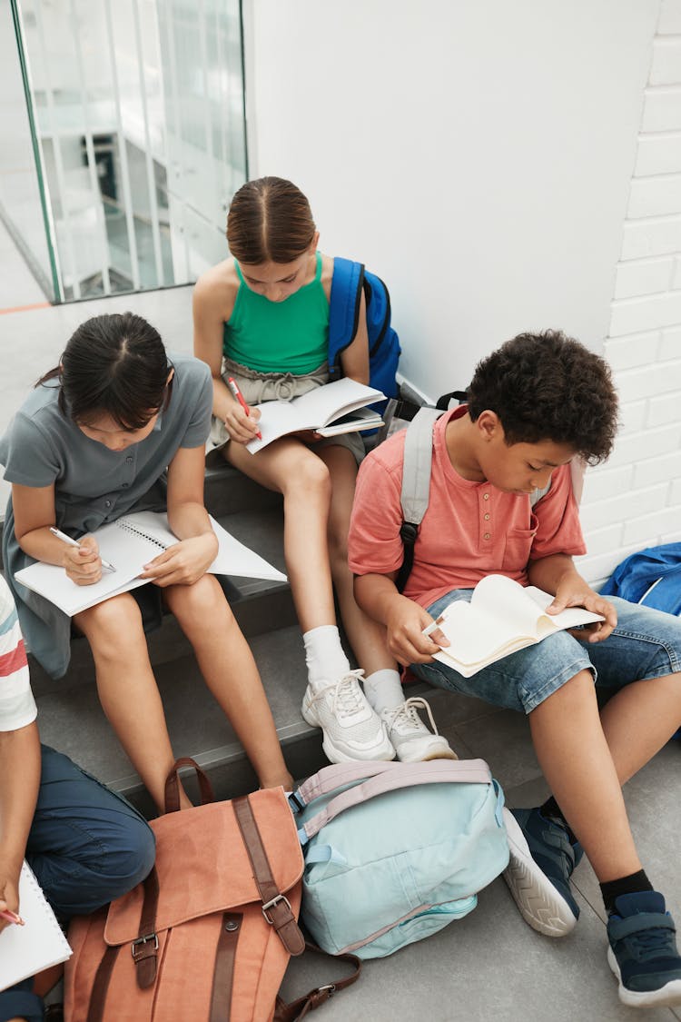 Students Sitting On The Stairs