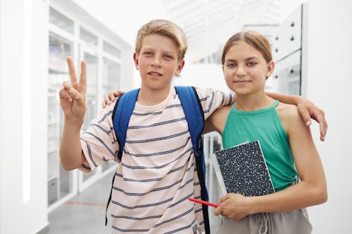 Boy and Girl Smiling at the Camera