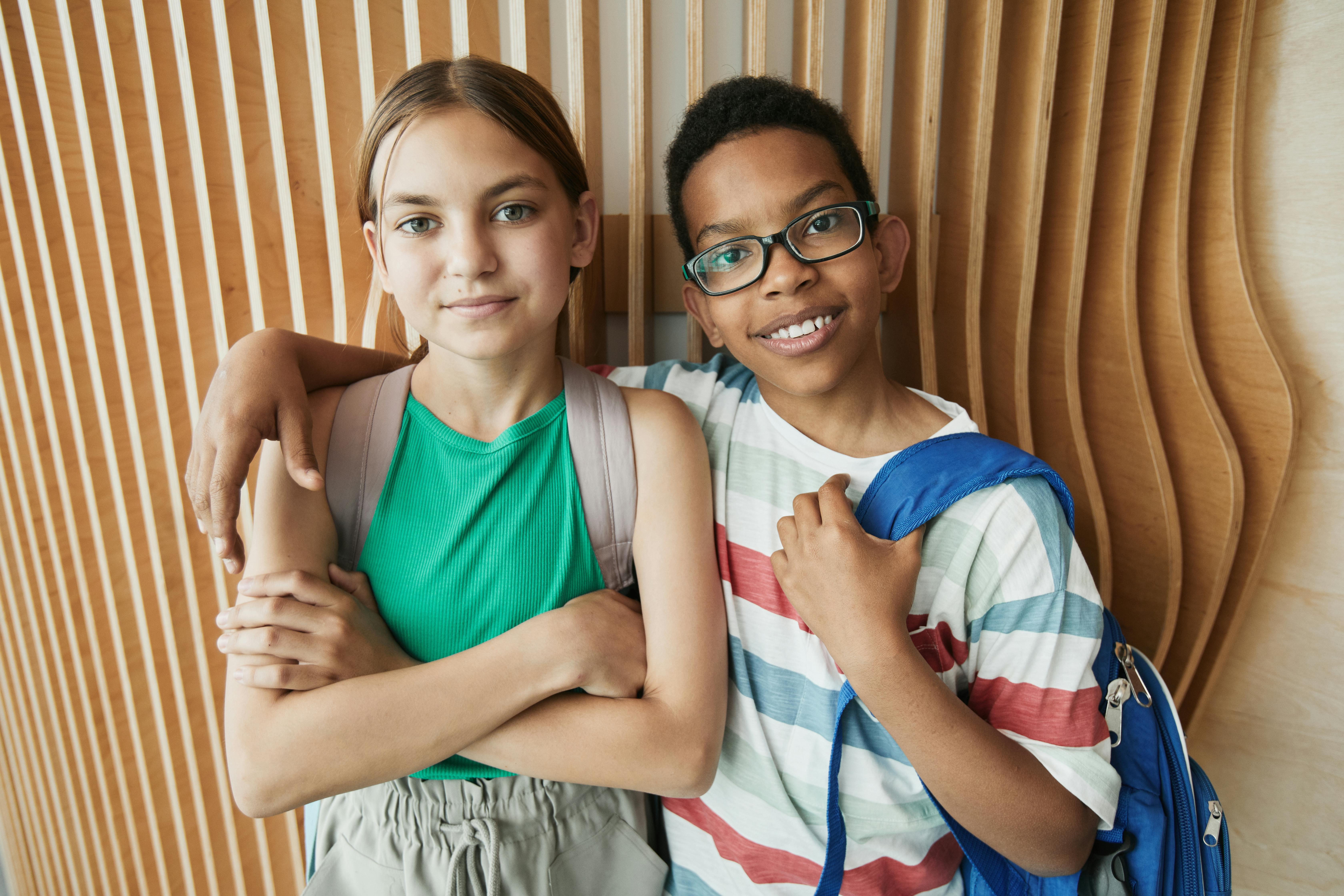 young boy hugging a girl