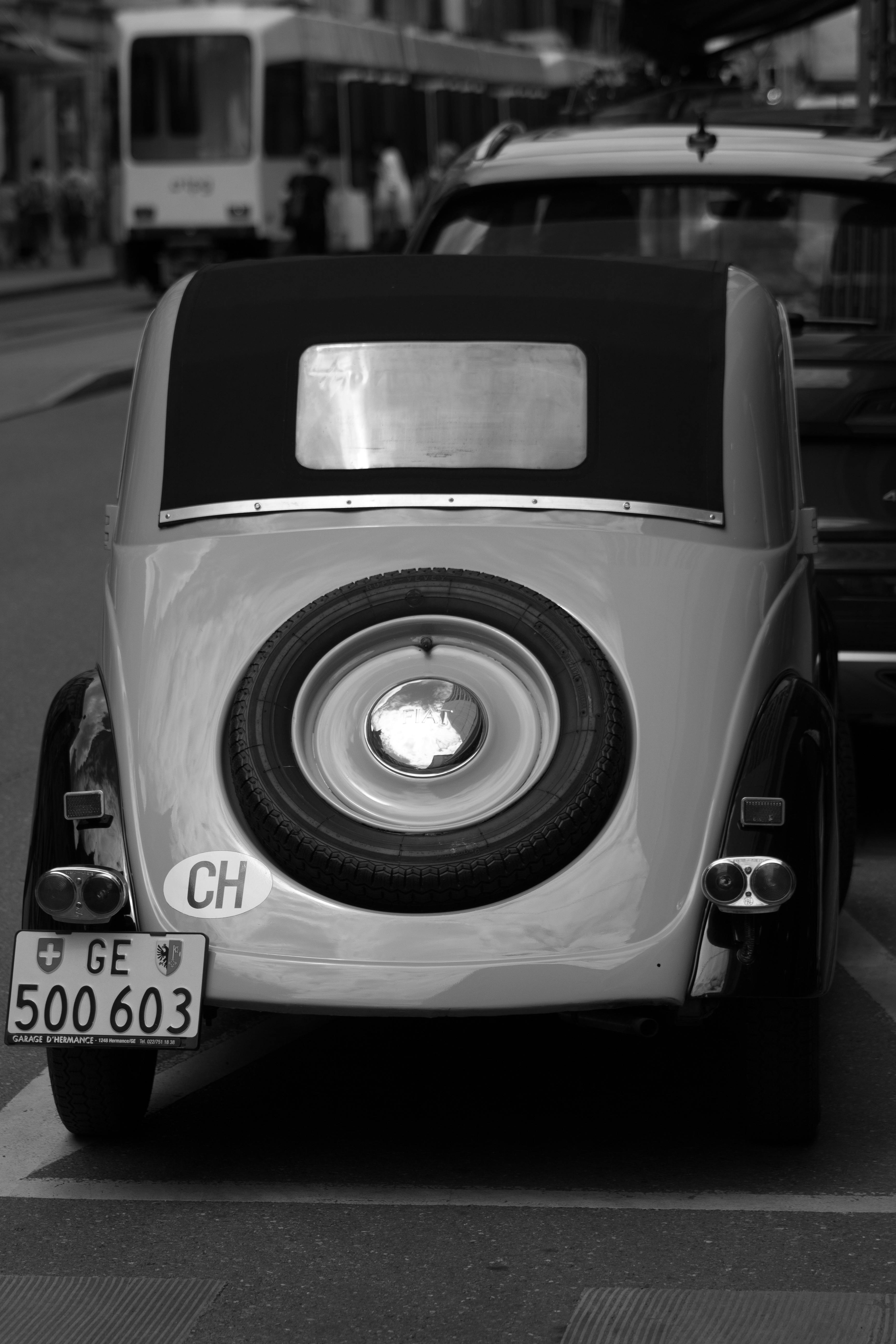 Vintage Car Between Classical Buildings · Free Stock Photo