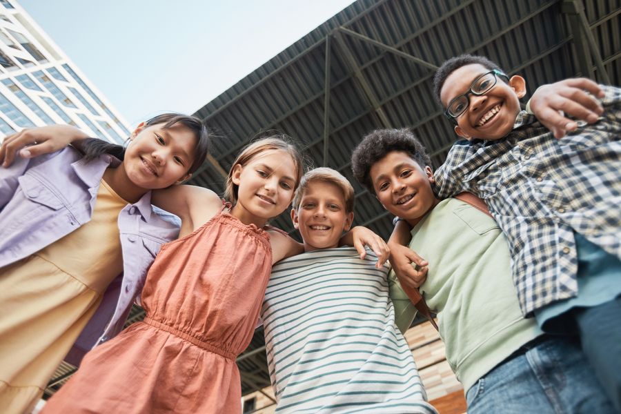 Group of kids with arms around each other
