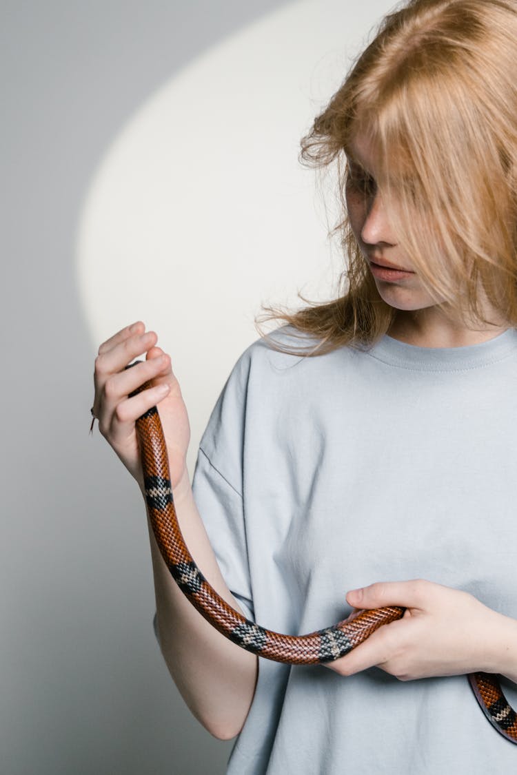 A Woman Overcoming Her Fear Of Snakes