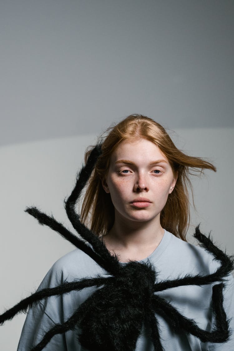 A Woman Overcoming Her Fear Of Spiders