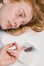 Close-Up Photo of a Fearful Woman Lying Down while Overcoming Her Fear of Cockroaches