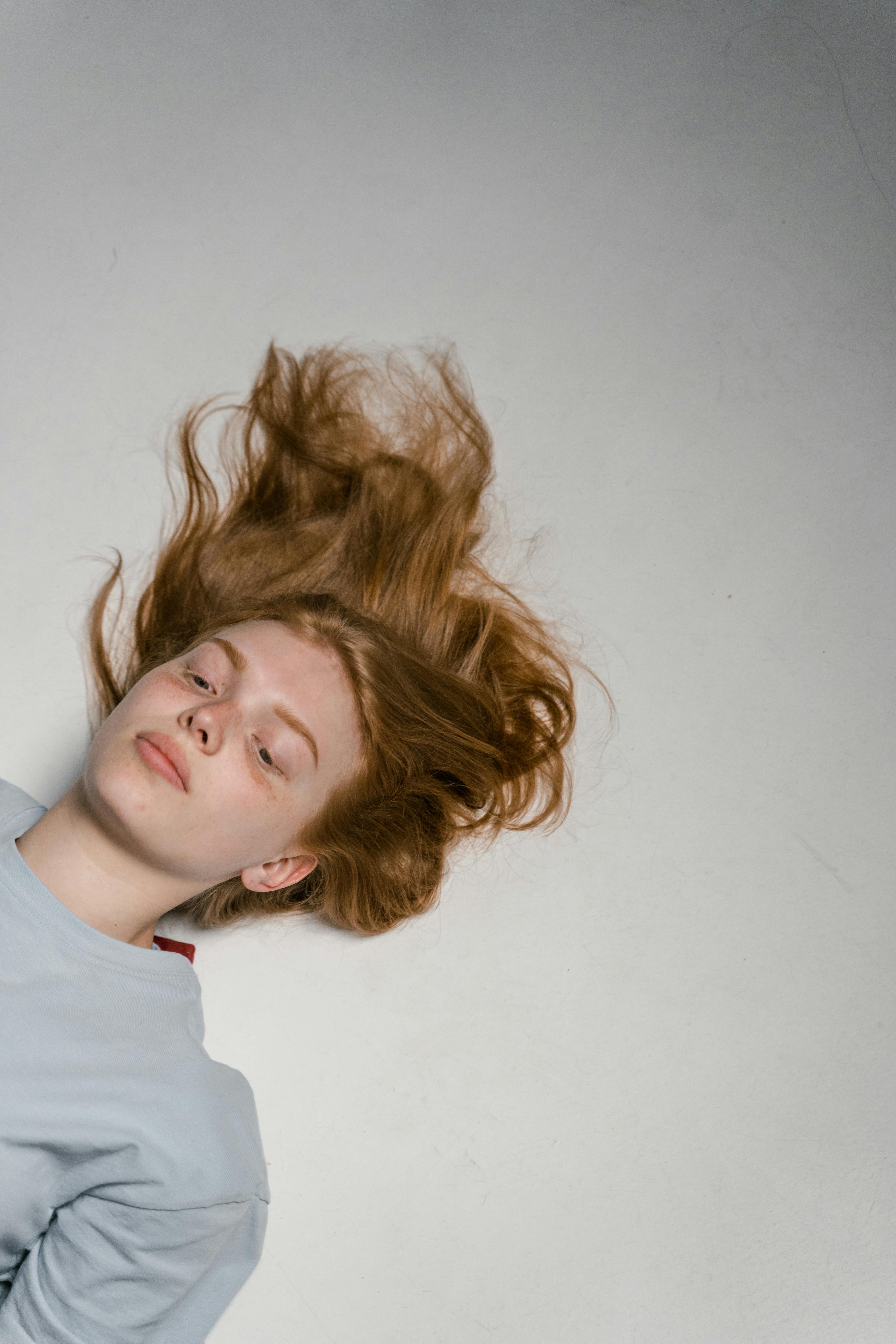 a lonely woman lying down by herself