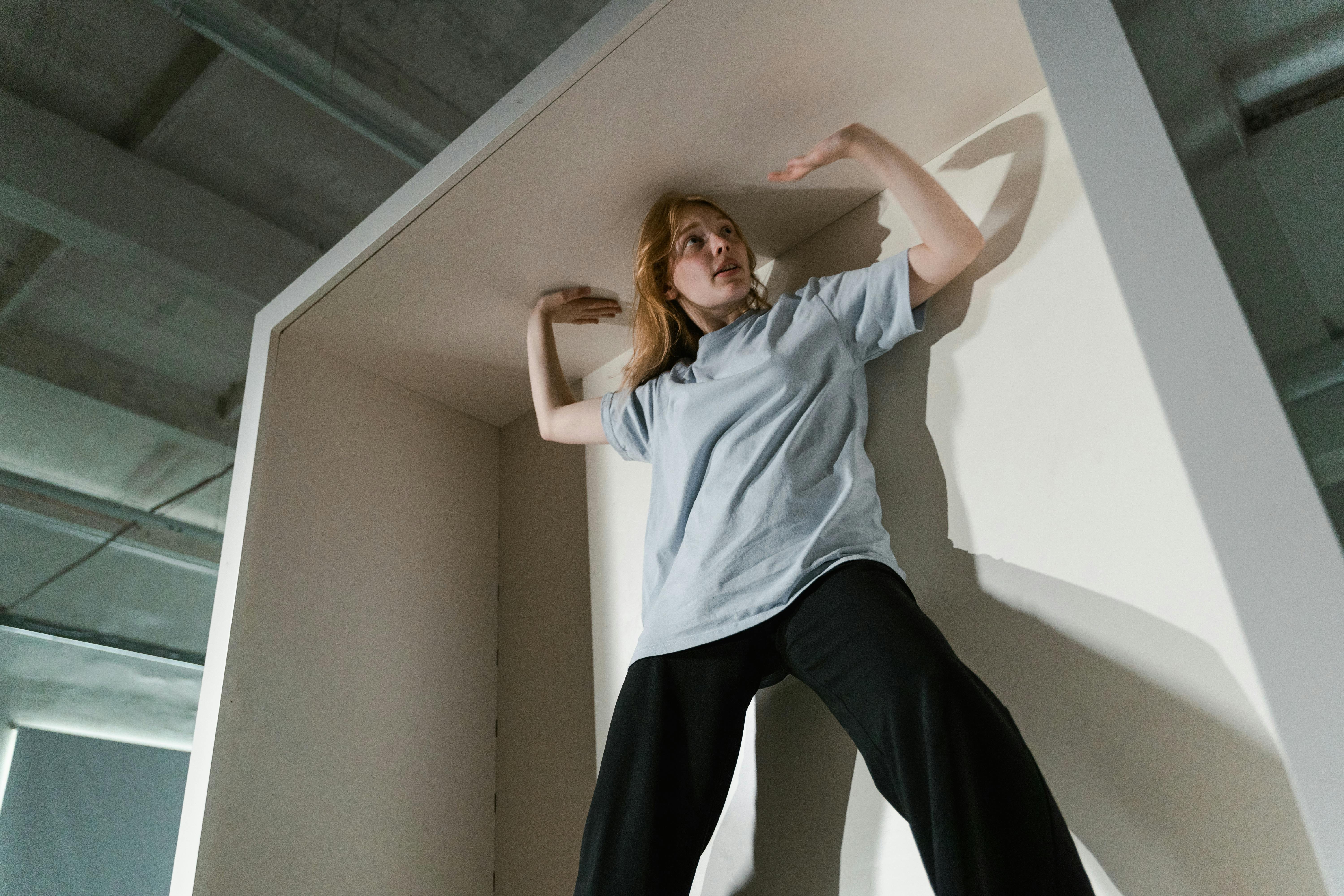 a fearful woman having claustrophobia in a cabinet