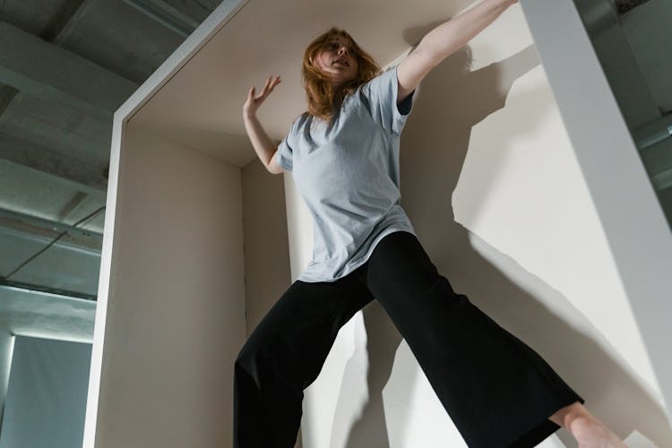 A Fearful Woman Having Claustrophobia In A Cabinet