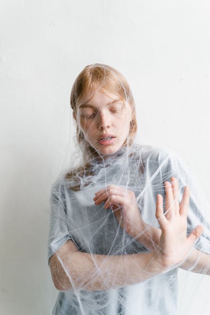 A woman trapped in a web depicting feelings of anxiety and helplessness.