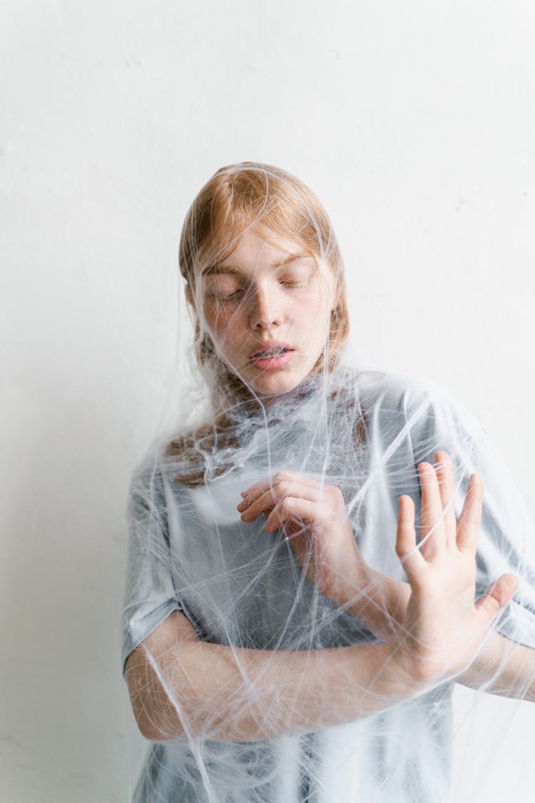 A Helpless Woman Trapped In A Spider Web