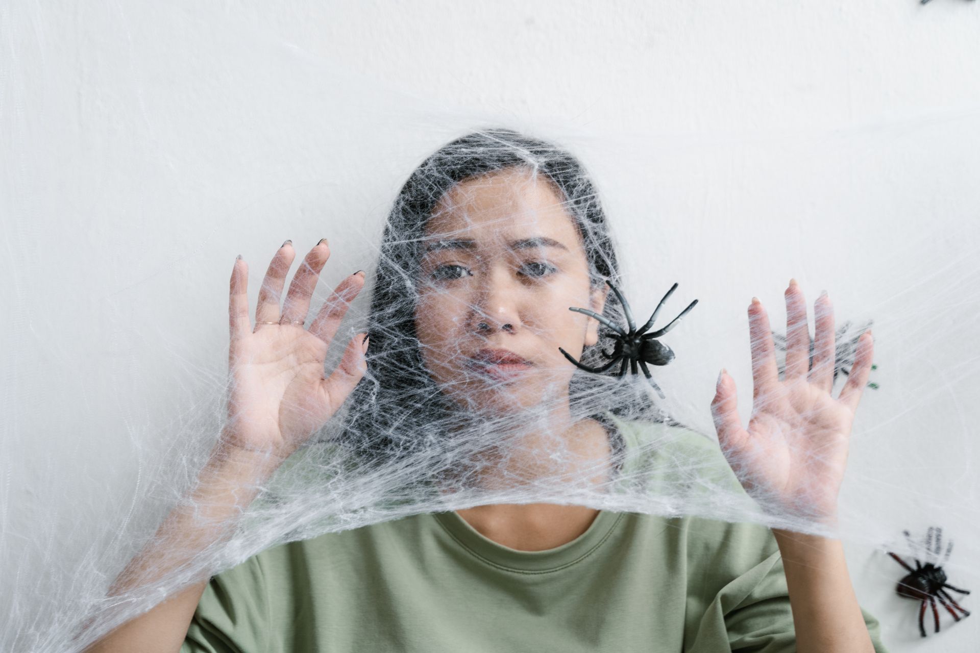 A Helpless Woman Trapped in a Spider Web