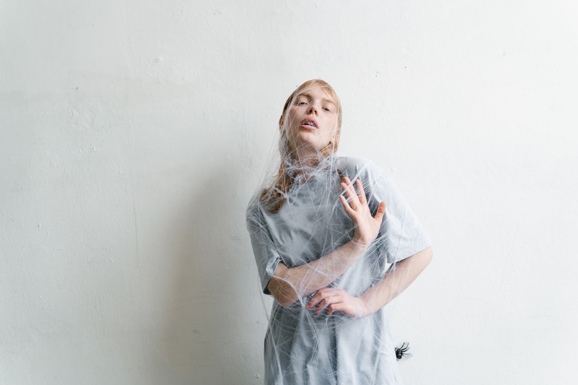 A Helpless Woman Trapped in a Spider Web