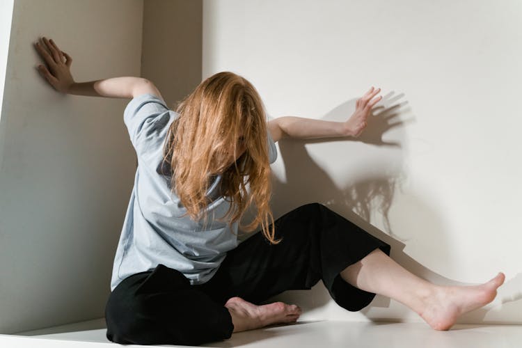 A Fearful Woman Having Claustrophobia In A Cabinet