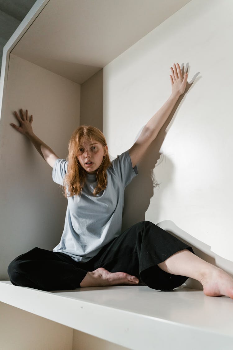 A Fearful Woman Having Claustrophobia In A Cabinet