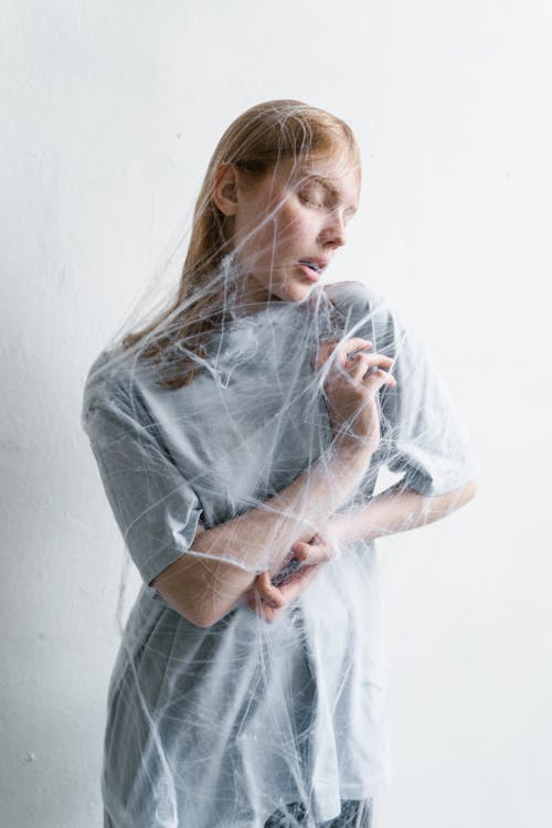 A Helpless Woman Trapped in a Spider Web