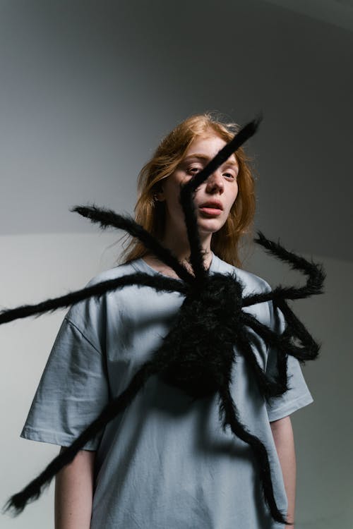 Free A Woman Overcoming Her Fear of Spiders Stock Photo