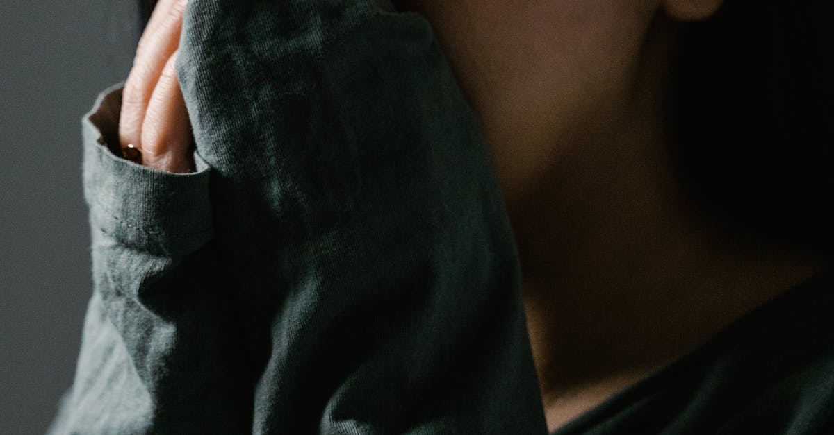 Close-up of a distressed woman indoors, showing anxiety and stress.