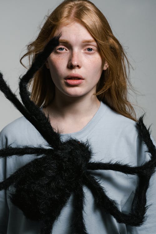 A Fearful Woman Having Arachnophobia