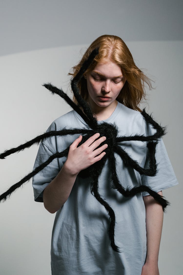 A Woman Overcoming Her Fear Of Spiders