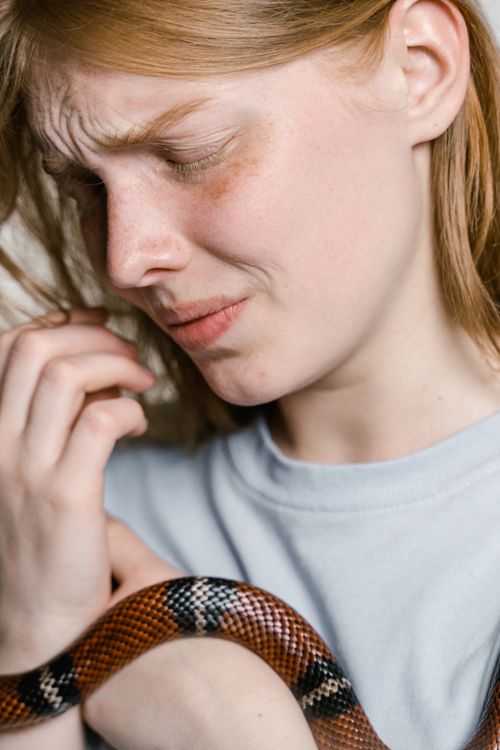 Close-Up Photo of a Fearful Woman Having Ophidiophobia · Free Stock Photo