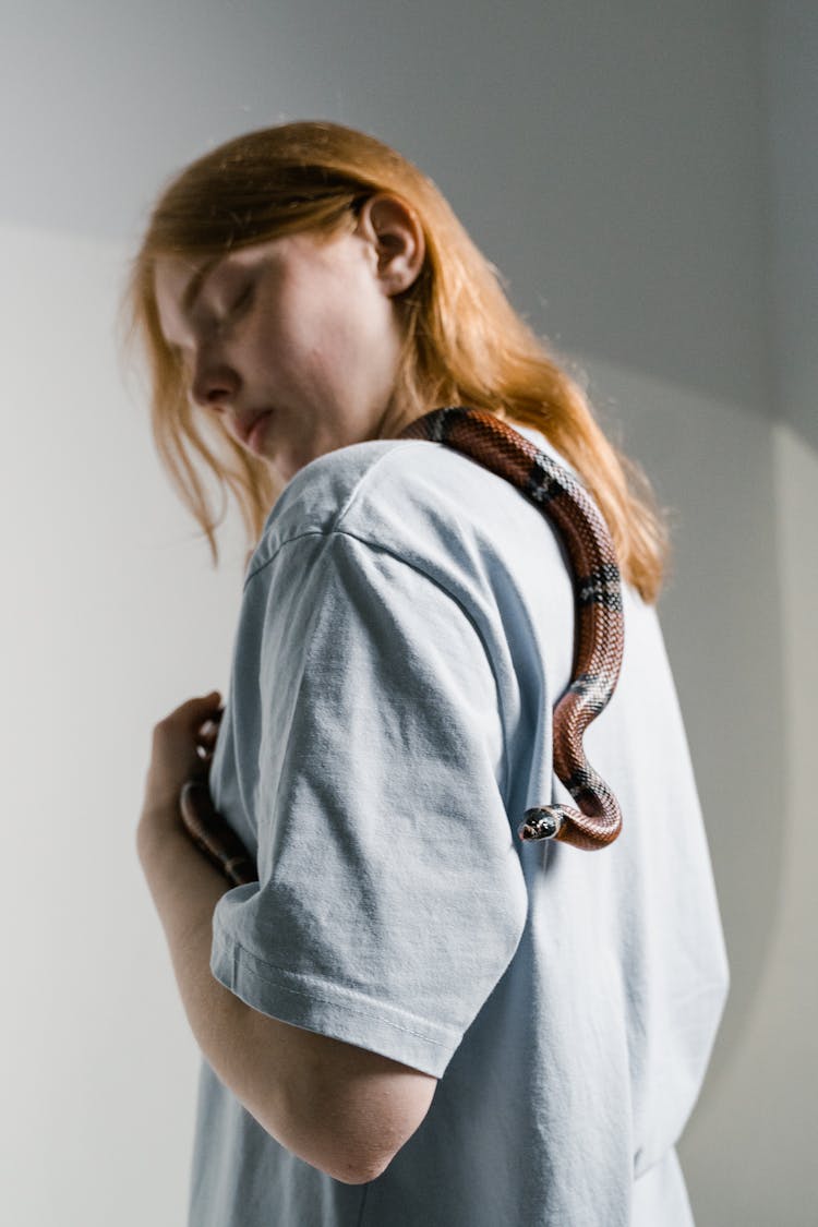 A Woman Overcoming Her Fear Of Snakes