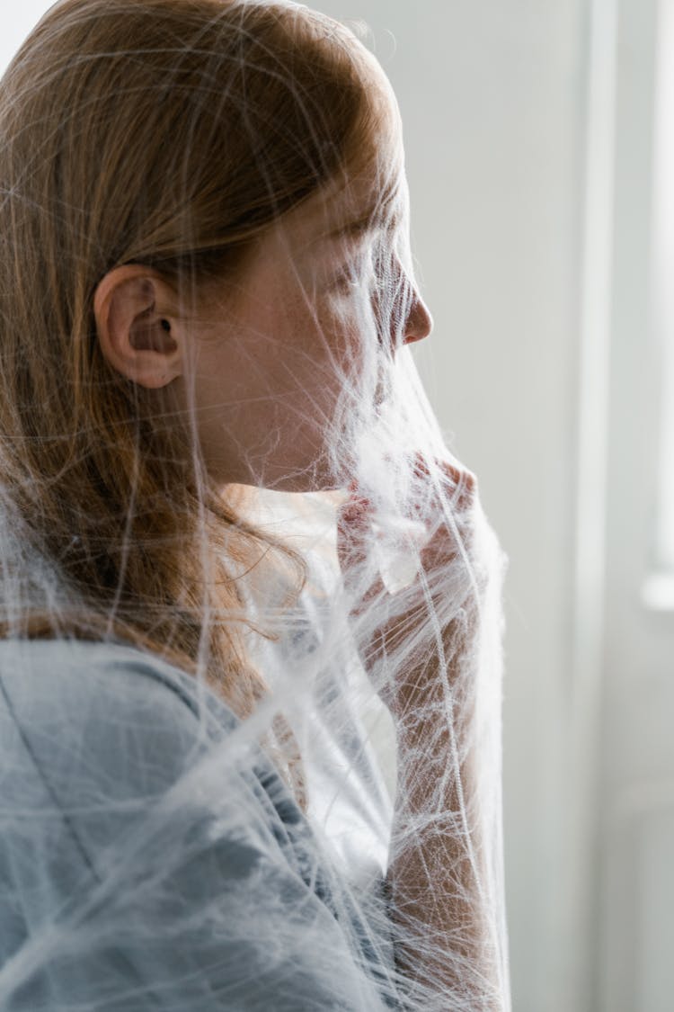 A Helpless Woman Trapped In A Spider Web