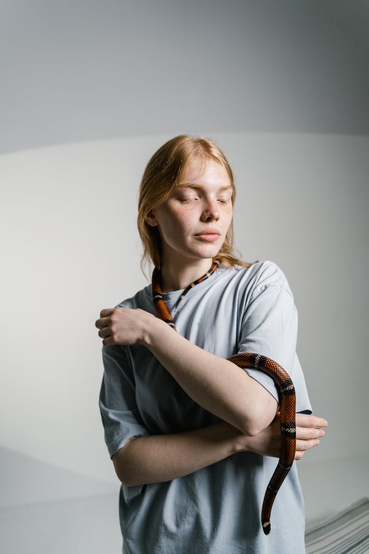 A Woman Overcoming Her Fear Of Snakes