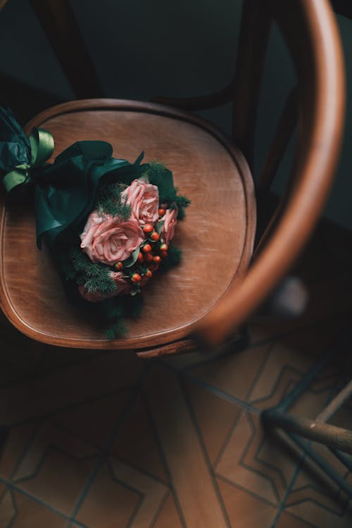 A Bouquet of Flowers on a Wooden Chair