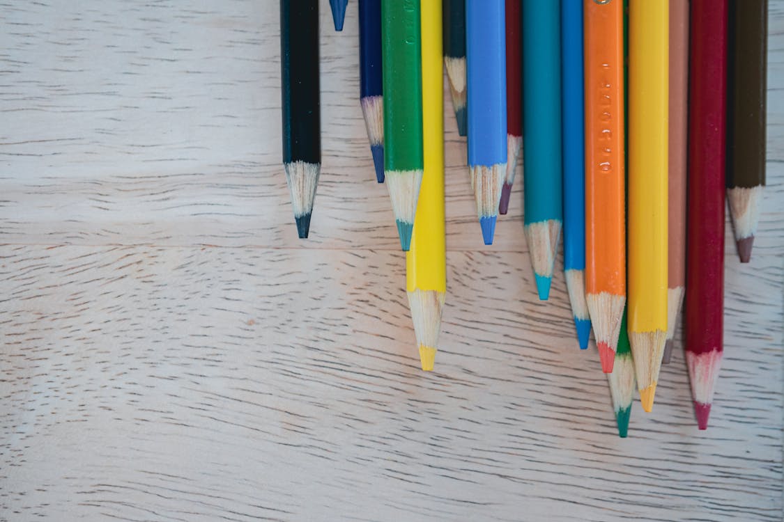 Free Color Pencils on Wooden Table Stock Photo