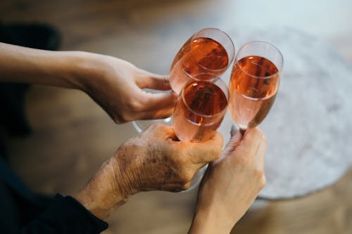 People Holding Glasses of Champagne