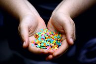 Person Holding Multi Colored Candies