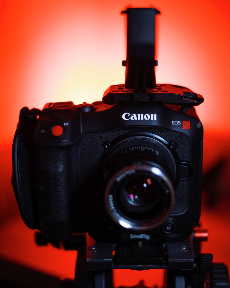Canon camera on orange background