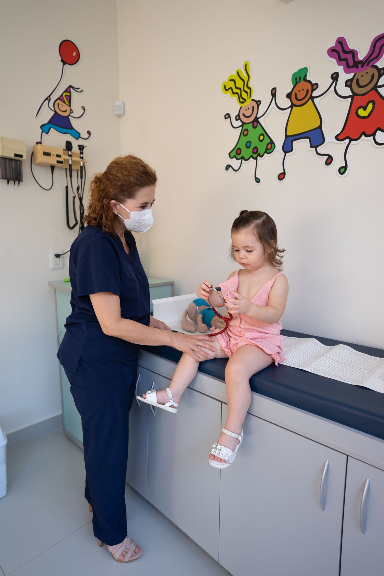 Nurse examining child