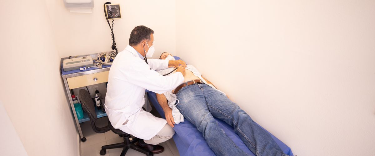 Doctor consulting with a patient during examination