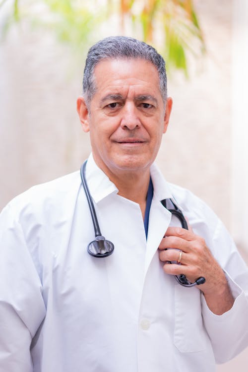 Free A Doctor Wearing a White Coat  Stock Photo