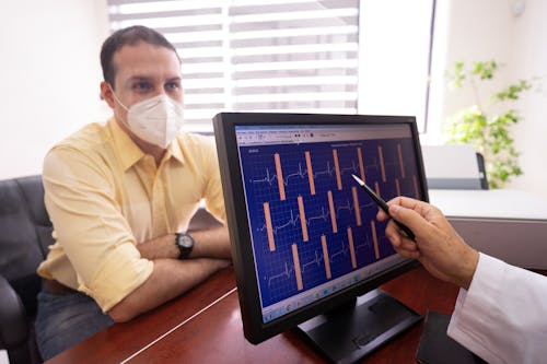 Free A Doctor Checking a Patient's ECG Results Stock Photo