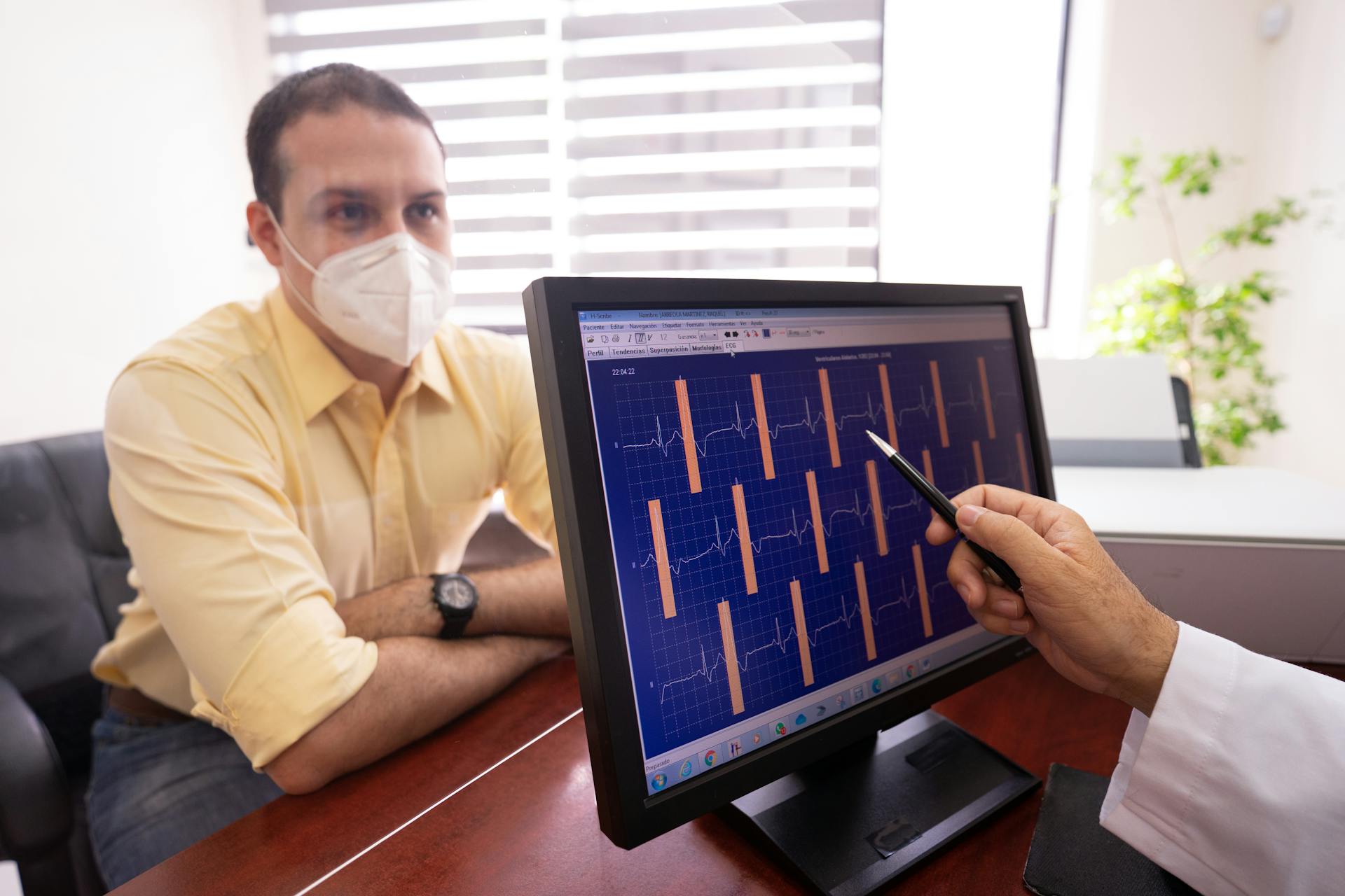 A Doctor Checking a Patient's ECG Results